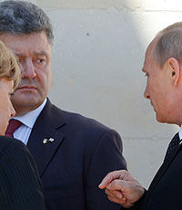 Путин кратко пообщался с Порошенко
