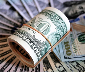 Доллар уcилился рекордно за семь лет - Reuters